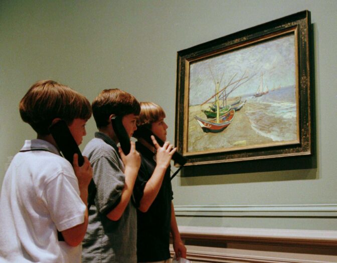 STUDENTS VIEW VAN GOGH WORKS.