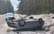 Ropažos uz slidena autoceļa apgāzies BMW