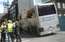 FOTO: Baznīcas ielā asfaltā ielūzis tūristu autobuss