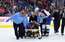 Pēc neveiksmīgas sadursmes NHL tiesnesis Danings no laukuma tiek nonests uz nestuvēm